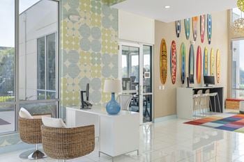 A living room with surfboards on the wall